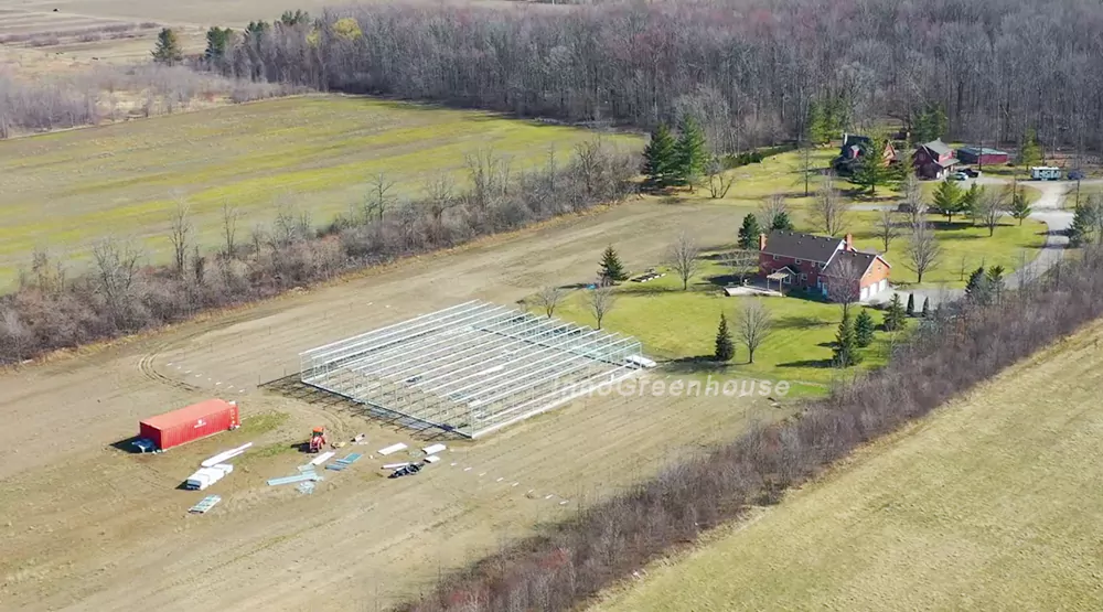 A construction site of our connected steel structure greenhouse on a farm in Canada 2