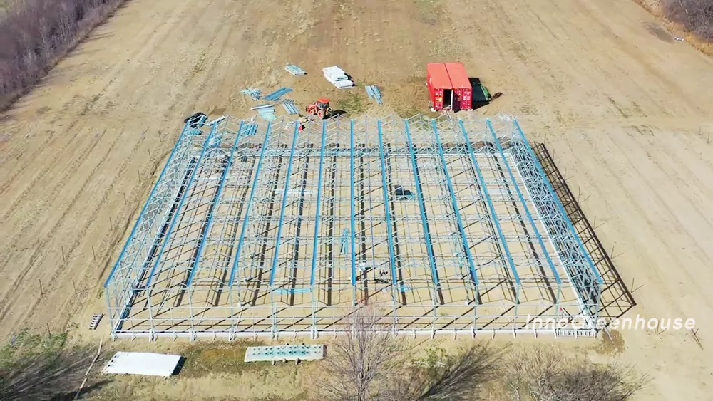 A construction site of our connected steel structure greenhouse on a farm in Canada 1