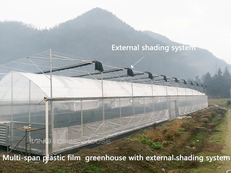 Greenhouse with an external shading system on the top